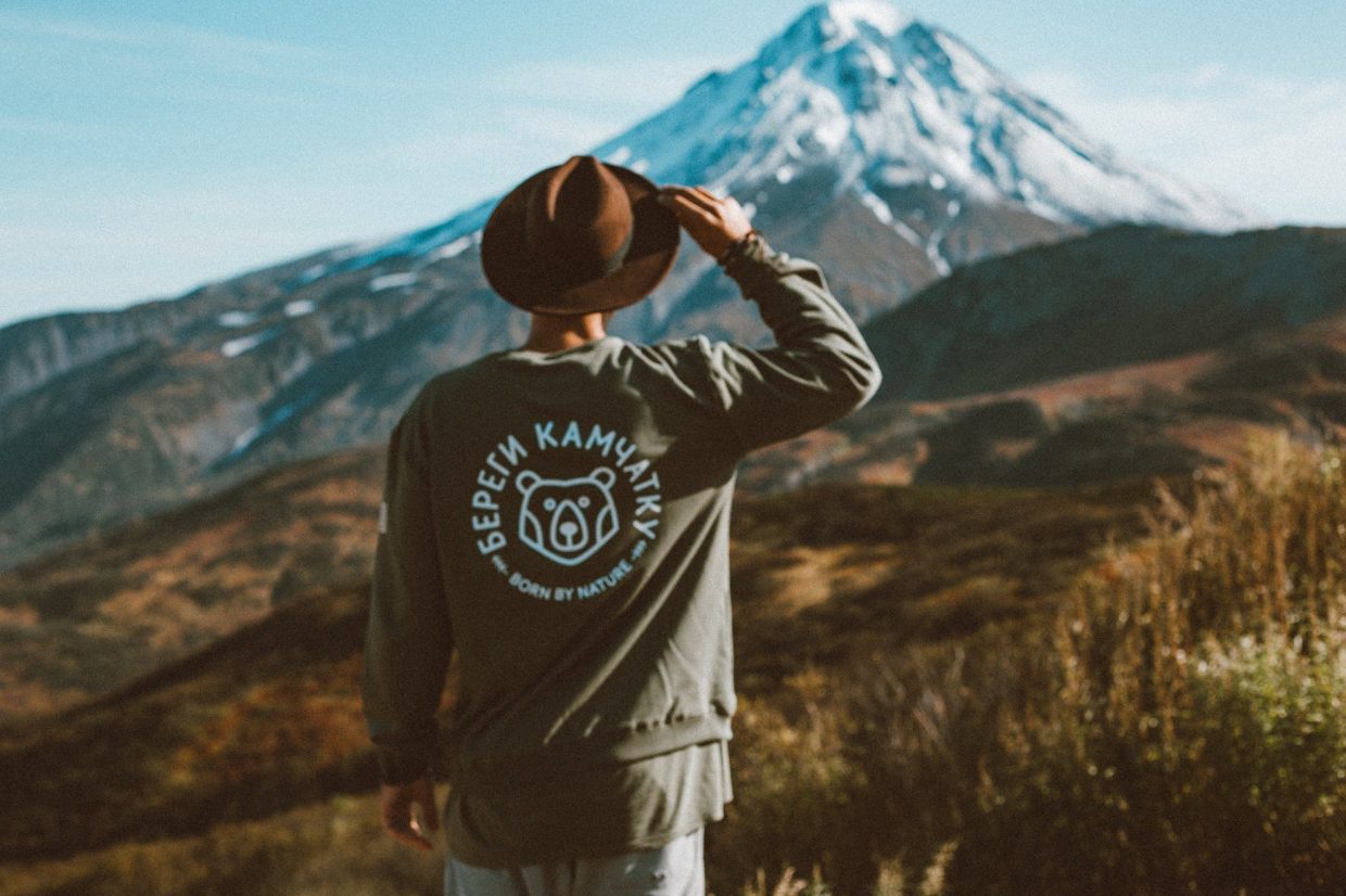 lonely man in hat admiring picturesque view