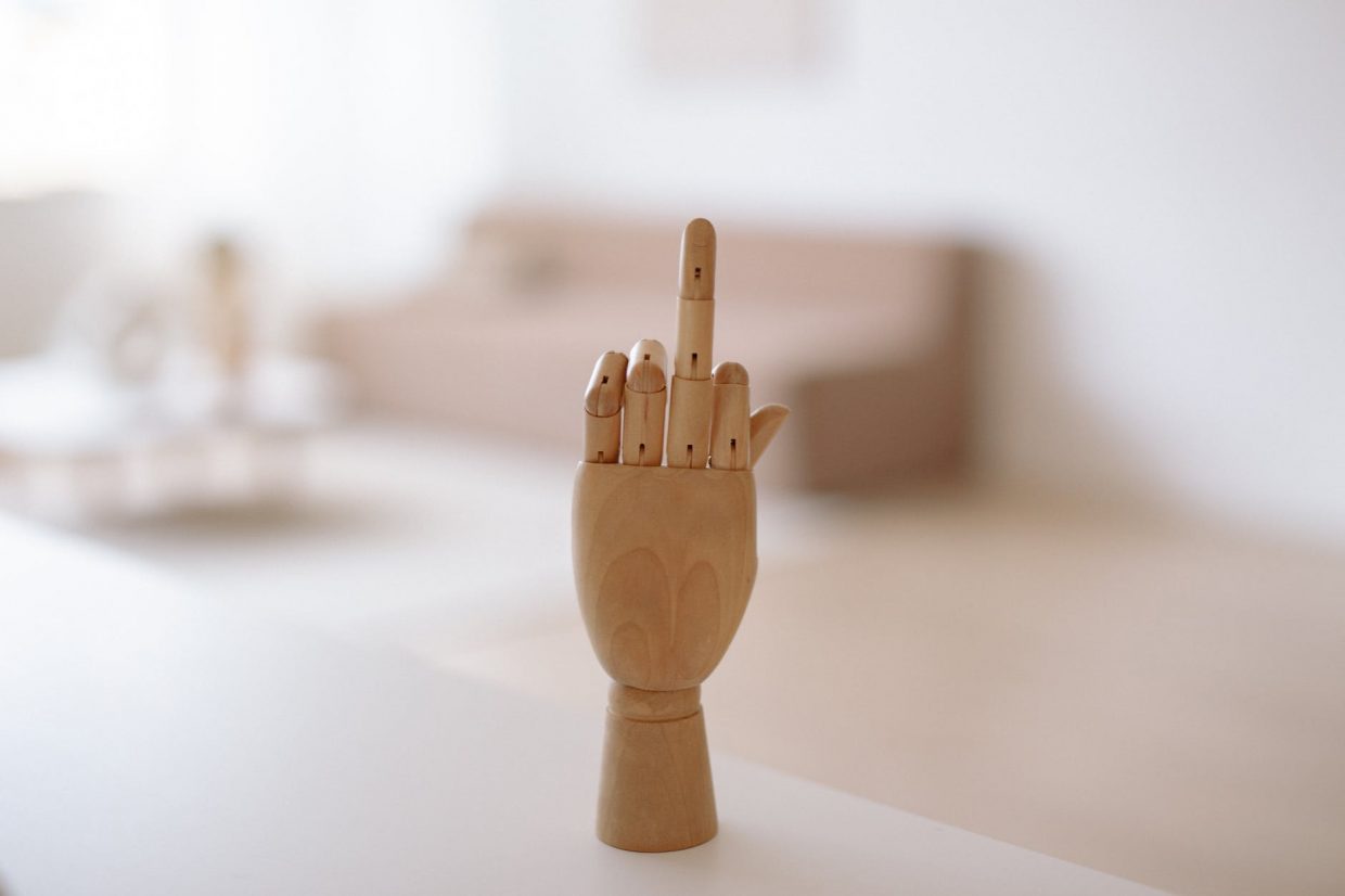 brown wooden toy on white table