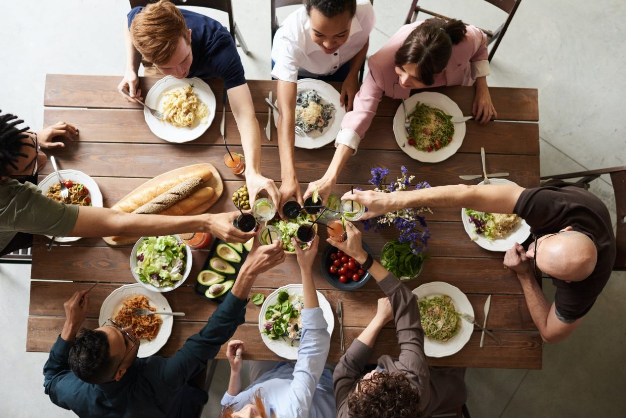 group of people making toast