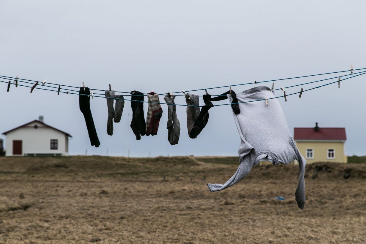 socks and jumper hanging on a wire for drying